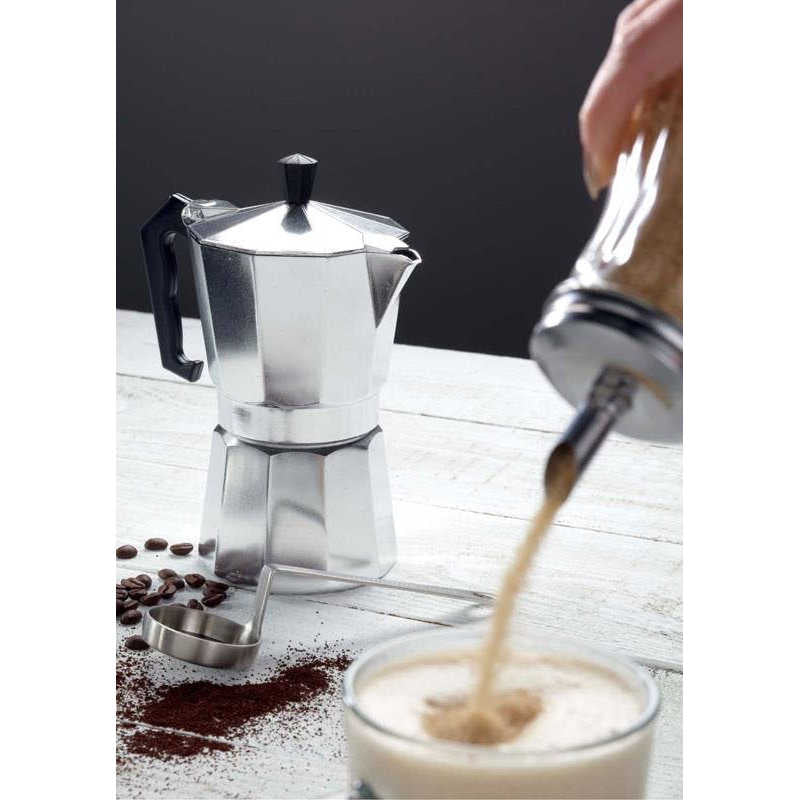 Le'Xpress espresso maker on table with coffee